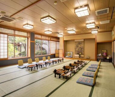 Large tatami dining room with low tables and cushions at Hotel Heian, Yamanashi, Chūbu, Japan