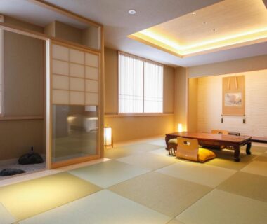 Spacious tatami room with low table, zabuton cushions, shoji screens and soft ambient lighting, Hotel Honnoji Kyoto