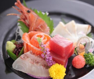Assorted sashimi with shrimp, tuna, salmon and garnishes at Hotel Kaminoyu Onsen, Yamanashi
