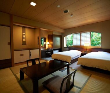 Tatami room with twin beds and low table, Hotel Kazahaya, Ōita, Kyūshū, Japan