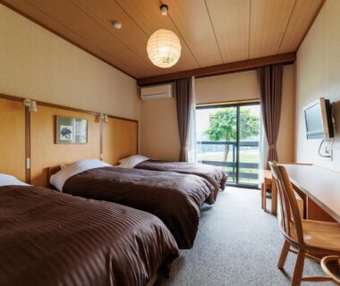 Three single beds with desk and balcony opening to greenery, Hotel Kikori, Gifu, Chūbu