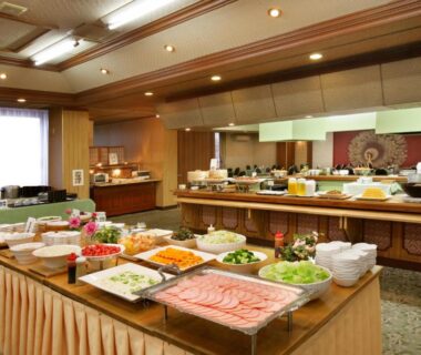 Buffet spread with salads and cold cuts on tables inside Hotel Kimura dining room in Gunma Kantō