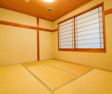 Tatami room with shoji window and wooden ceiling at Hotel Kinu in Tochigi, Kantō, Japan