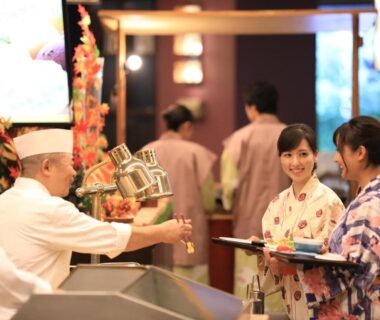 Chefs serving dishes to guests in yukata at Hotel Koyokan in Iwate, Tōhoku