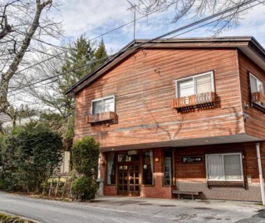 Two-story wooden exterior of Hotel La Montagne Furuhata with entrance and balconies, Nagano, Chūbu, Japan