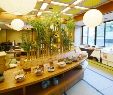 Tatami dining room with buffet counter, bamboo centerpiece and lanterns at Hotel Manyotei in Tochigi
