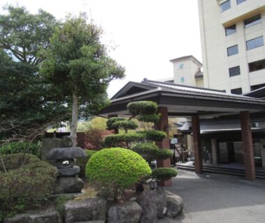 Manicured entrance garden with stone lantern at Hotel Manyotei in Tochigi, Kantō, Japan