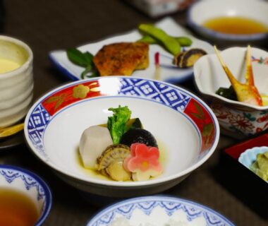 Traditional multi-dish Japanese meal served in lacquer and ceramic bowls at Hotel Mimatsu in Nara