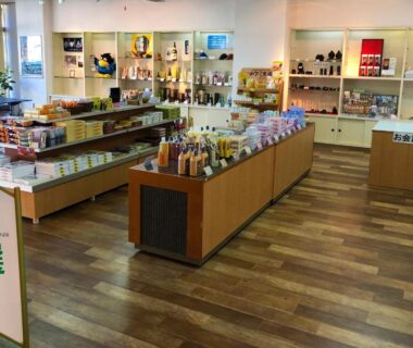 Souvenir shelves and local products arranged on wooden displays inside Hotel Nagisaya shop, Wakayama, Kansai
