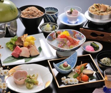 Assorted Japanese multi-course dishes on lacquerware at Hotel New Kotobuki, Nagano