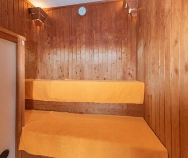 Interior wooden sauna with bench and towels, Hotel New Tsuruta, Ōita, Kyūshū, Japan