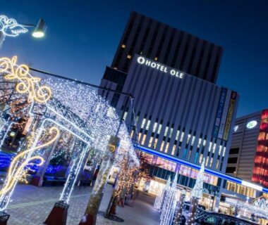 Night view of illuminated walkway and Hotel Ole facade in Shizuoka, Chūbu, Japan