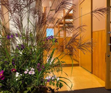 Large floral arrangement in wooden ryokan entrance at Hotel & Onsen 2307 Shigakogen Nagano Chūbu Japan