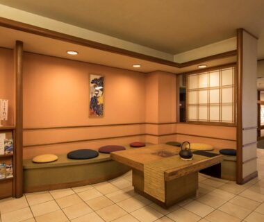 Low table with floor cushions and shoji screen at Hotel Shirakawa Yunokura in Tochigi