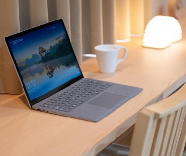 Laptop on wooden desk with lamp, cup, and chair in Hotel Sugicho room Kyoto