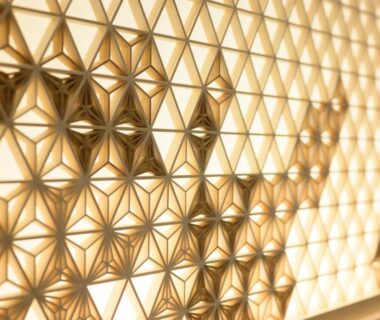 Backlit wooden lattice with asanoha geometric pattern in a ryokan interior at Hotel Sugicho, Kyoto