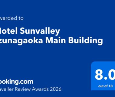 Blue Booking.com Traveller Review Award badge showing 8.0 rating for Hotel Sunvalley Izunagaoka Main Building in Shizuoka