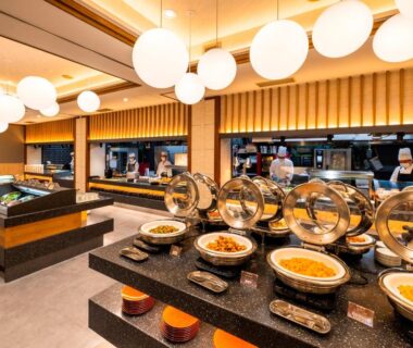 Buffet spread with chafing dishes and staff behind counter at Hotel Sunvalley Izunagaoka in Shizuoka, Chūbu