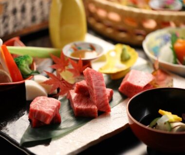 Lacquer tray with assorted sashimi, pickles and small bowls served at Hotel Tamanoyu in Nagano