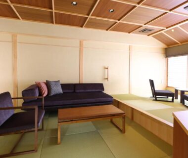 Tatami room with low table and sofa, shoji screens, Hotel Tamanoyu, Nagano, Chūbu, Japan
