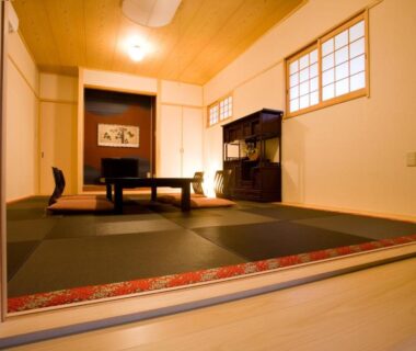 Tatami room with low table and shoji windows at Hotel Tenzankaku Kaiyutei in Wakayama, Kansai Japan