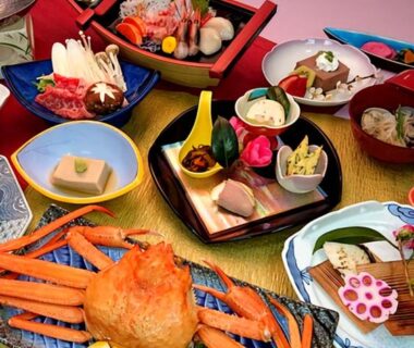 Seafood assortment with crab and sashimi on lacquer trays at Hotel Tetora Resort Tsuruoka, Yamagata