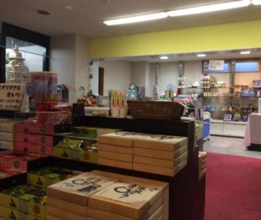 Shelves of boxed souvenirs and snacks at Hotel Tetora Resort Tsuruoka gift shop in Yamagata