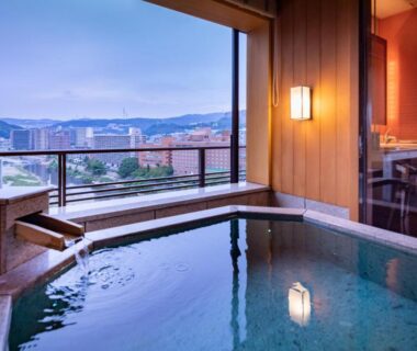In-room onsen bath with city view at Hotel Wakamizu in Hyōgo, Kansai