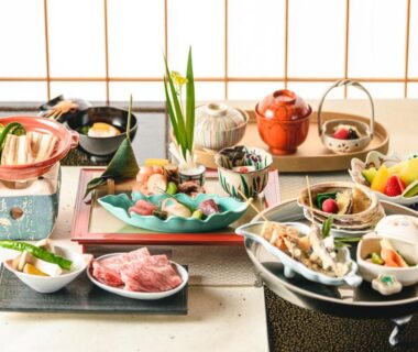 Multi-course Japanese meal laid out on table with teapot and shoji screens, Hotel Wakamizu, Hyōgo, Kansai