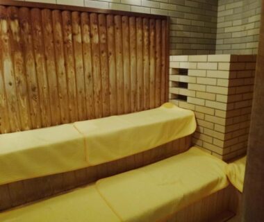 Wooden sauna benches and tiled walls at Hotel Wellness Notoji in Chūbu, Ishikawa, Japan
