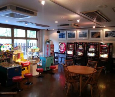 Indoor game corner with arcade machines and seating at Hotel Yunojin, Gunma, Kantō