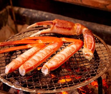 Grilled crab legs on a charcoal grill at Hotobil B&B 潤 in Nara, Kansai