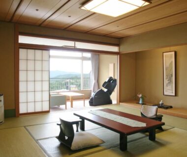 Traditional tatami room with low table, zabuton cushions, shoji screens and balcony view at Hyoe Koyokaku Hyōgo