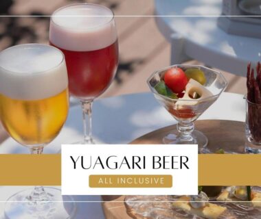 Two beer glasses and appetizers on outdoor table at Ichiraku Tendo Spa & Brewery, Yamagata