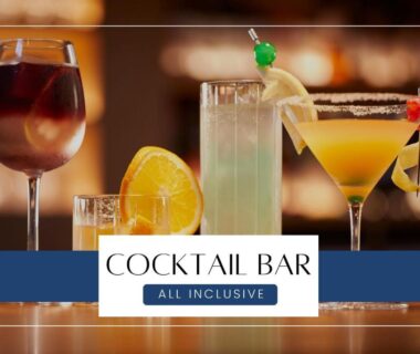 Assorted cocktails on a polished bar counter with cocktail bar sign at Ichiraku Tendo Spa in Yamagata