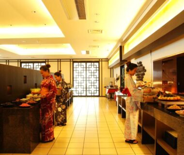 Guests in kimono selecting buffet dishes in hotel dining hall at Ijika Daiichi Hotel Kagura, Mie