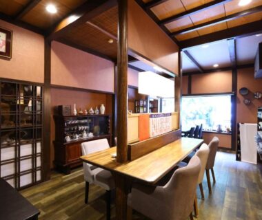 Warm wooden communal dining room at Ikariya Ryokan, Nagano, Japan
