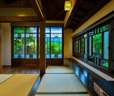 Traditional tatami room with shoji screens and wooden veranda at Ikkoten in Oita