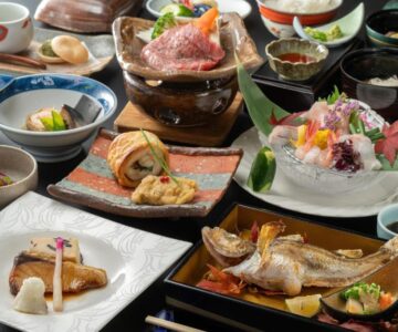 Assorted Japanese dishes on lacquer trays at Ikkyu -Seaside Hotel- Yamagata