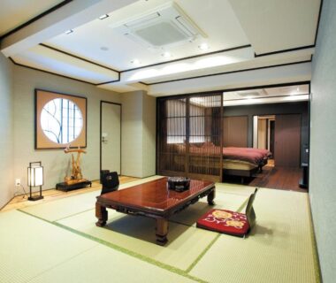 Traditional tatami room with low table and futon at Irori Houraku in Hyōgo, Kansai, Japan