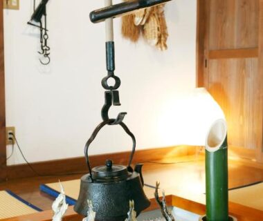 Irori hearth with hanging kettle and tatami seating at Irorino Yado Sankichi, Shizuoka, Chubu Japan