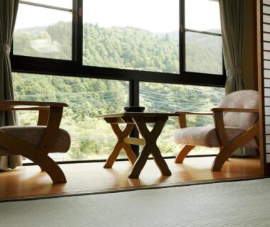 Tatami seating by window overlooking forested hills at Irorino Yado Sankichi, Shizuoka, Chūbu Japan