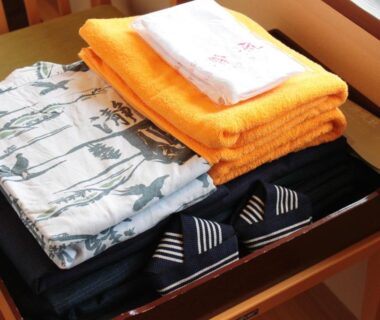 Folded yukata, towels and slippers on tray at Iruka Onsen Hotel Seiryuusou, Mie, Kansai