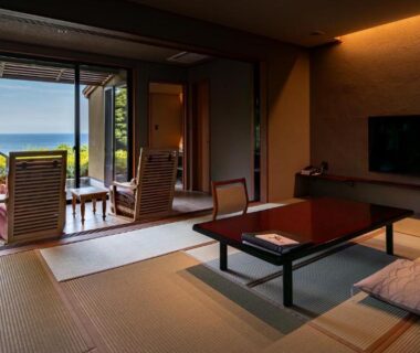 Tatami room with low table and balcony overlooking the sea at Isaribi (No Children), Shizuoka