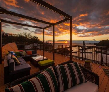 Outdoor terrace lounge under pergola at sunset with sea view, Isaribinoyado Seaside Kancho, Wakayama