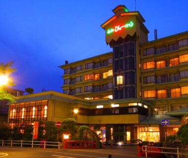 Illuminated exterior of Isawa View Hotel at dusk, multi-story facade and lit entrance in Yamanashi, Chūbu