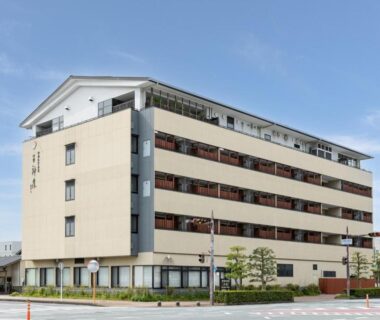 Exterior of multi-story ryokan with balconies at Isegekusando Iseshinsen in Mie, Kansai