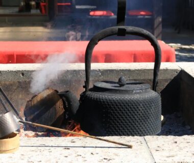 Cast iron kettle steaming over a traditional hearth at Itamuro Onsen Daikokuya, Tochigi