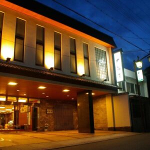 Warmly lit entrance and lobby of Itaniya ryokan at dusk in Nara, Kansai