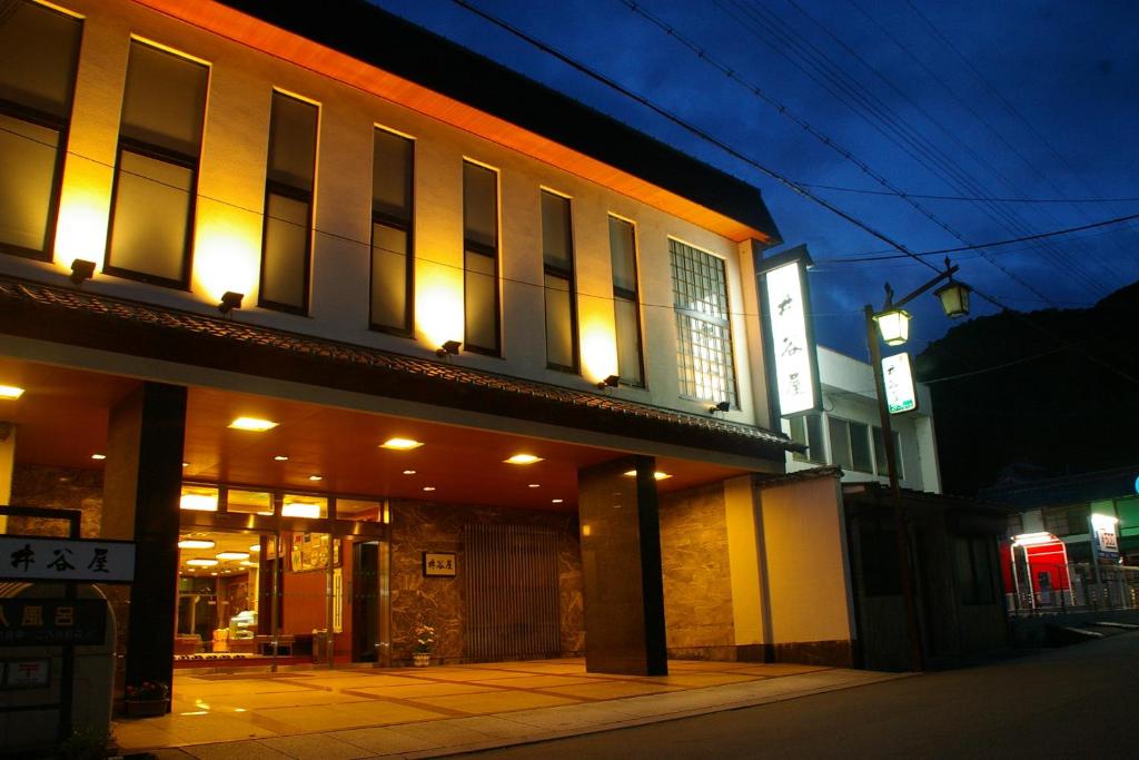 Illuminated ryokan entrance Itaniya Nara Kansai Warmly lit entrance and lobby of Itaniya ryokan at dusk in Nara, Kansai